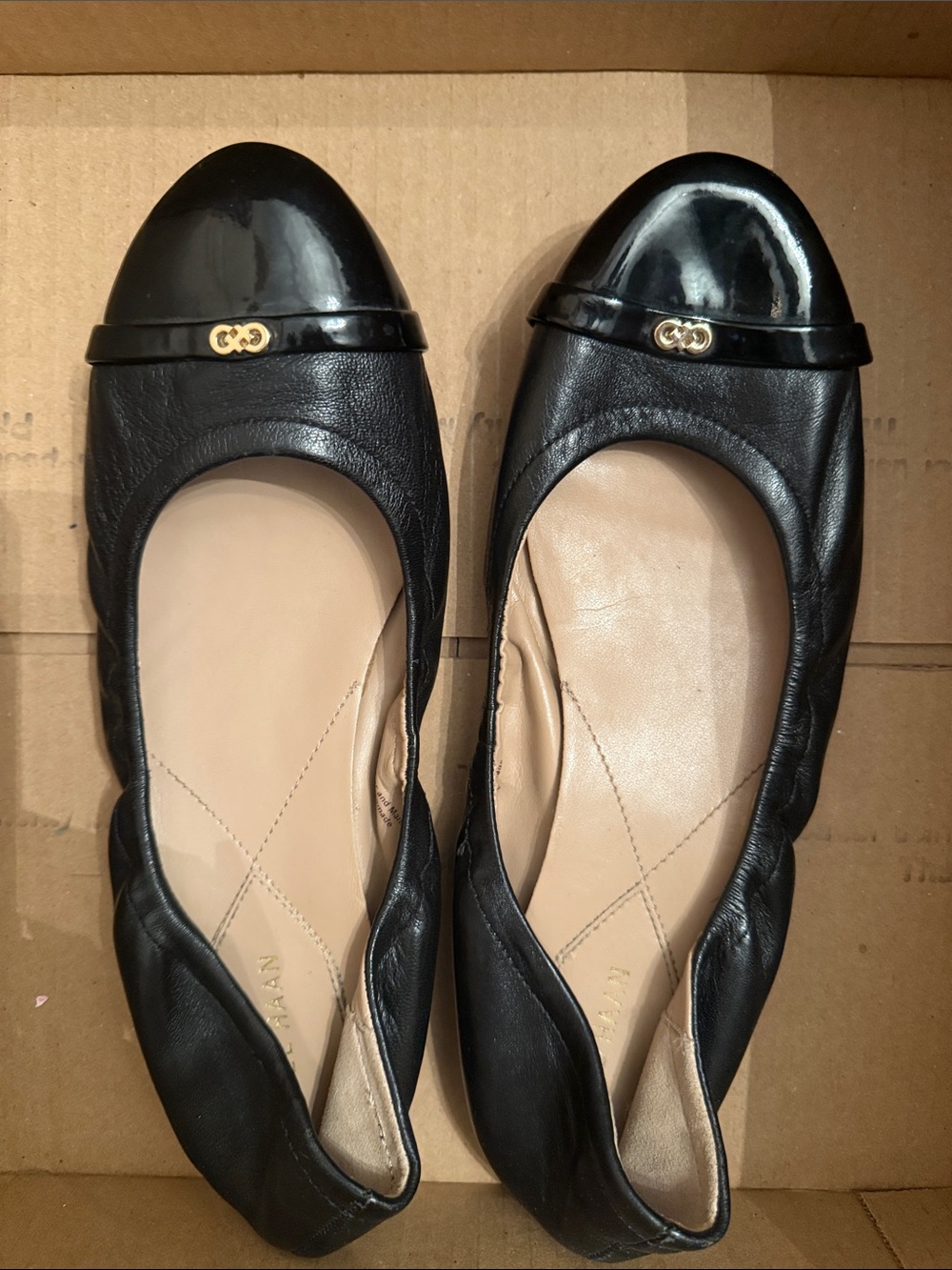 Cole Haan Black Leather Ballet Flats with Patent Cap Toe and Gold Accent